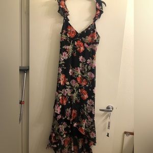 Woman’s large dress. Longer in the back and shorter in the front. Zipper in back